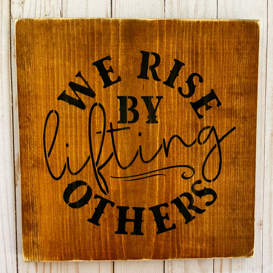 We Rise By Lifting Others Sign